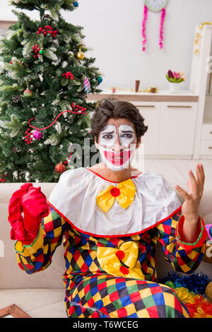 Funny clown in Christmas celebration concept Stock Photo