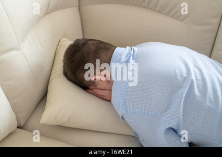 Depressed Teenager Lying Face Down On Sofa Stock Photo 245192919