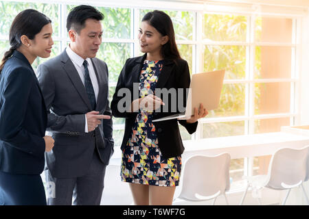 Business people talking at cafe window Stock Photo