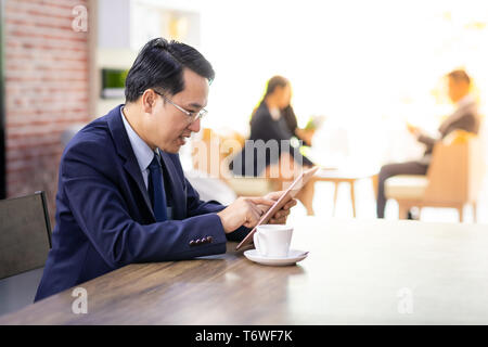 Businessman working in cafe Stock Photo