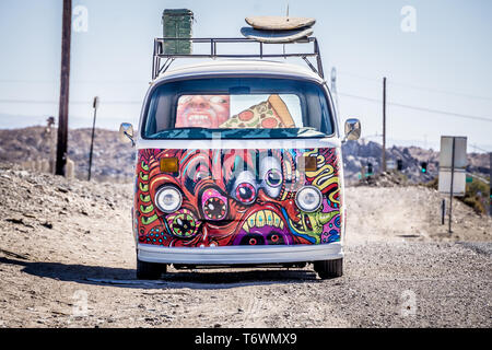 cool volkswagon with graffiti on side of the road Stock Photo