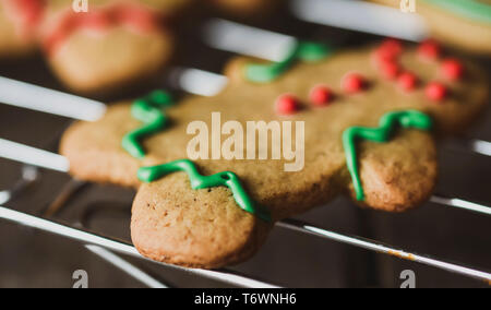 Close up of colorful icing on gingerbread man cookie. Stock Photo