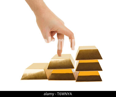 Hand and stairs made of gold bars Stock Photo