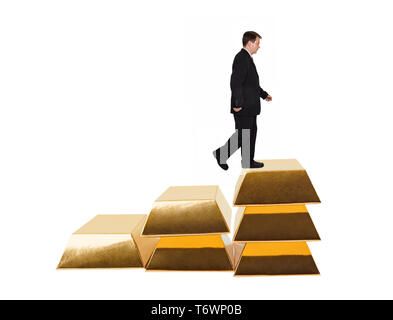 Businessman and stairs made of gold bars Stock Photo