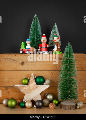 three Christmas figures reindeer Santa Claus toys xmas decoration Stock Photo