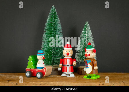 three Christmas figures reindeer Santa Claus toys Stock Photo