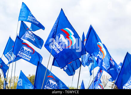 Samara, Russia - May 1, 2019: Flags of the party United Russia against the blue sky Stock Photo