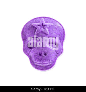 One purple army Skull, Ecstasy, MDMA, Amphetamine or medication pill shaped like a skull isolated on a white background. Stock Photo