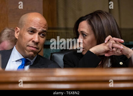 United States Senator Cory Booker (Democrat of New Jersey), left, and US Senator Kamala Harris (Democrat of California), right, in discussion as US Attorney General William P. Barr testifies before the US Senate Committee on the Judiciary on the “Department of Justice's Investigation of Russian Interference with the 2016 Presidential Election” on Capitol Hill in Washington, DC on May 1, 2019. The hearing will begin to answer questions about how the DOJ handled the conclusions from the Mueller probe. Both are announced candidates for the 2020 Democratic Party nomination for President of the U Stock Photo
