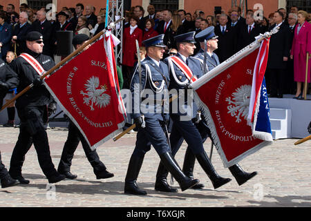 Warsaw, Masovian Voivodeship, Poland. 3rd May, 2019. Military troops seen marching while holding flags during the occasion.Celebration of the Constitution Day, May 3 at the Castle Square. Ceremonial military parade on the occasion of the celebration. Credit: Lidia Mukhamadeeva/SOPA Images/ZUMA Wire/Alamy Live News Stock Photo
