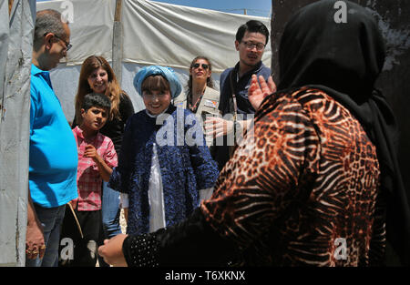 Anjar, Lebanon. 03rd May, 2019. Japanese actress and Goodwill ambassador for UNICEF Tetsuko Kuroyanagi (C) welcomed by a Syrian refugee as she enters her tent during a visit to a refugee camp. Credit: Marwan Naamani/dpa/Alamy Live News Stock Photo