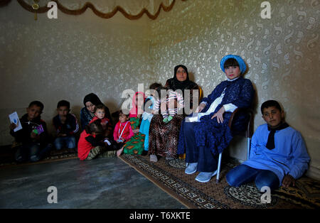 Anjar, Lebanon. 03rd May, 2019. Japanese actress and Goodwill ambassador for UNICEF Tetsuko Kuroyanagi (2-R) sits inside a tent with a Syrian refugee family during a visit to a refugee camp. Credit: Marwan Naamani/dpa/Alamy Live News Stock Photo