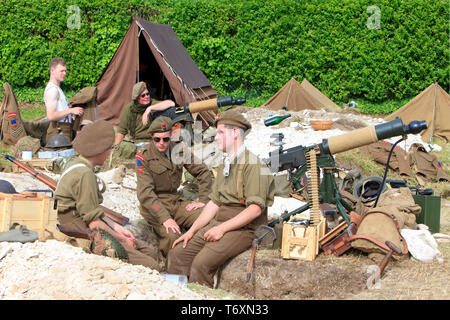 A detail of Royal Northumberland Fusiliers with their Vickers .303 machine guns during the World War II D-Day celebrations in Normandy, France Stock Photo