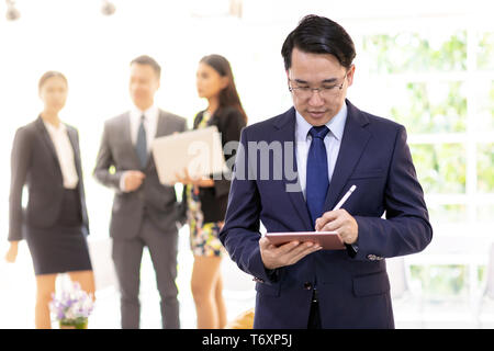 asian businessman working with team Stock Photo
