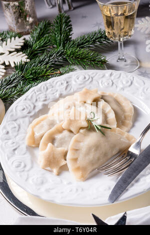 Polish style dumplings filled with sauerkraut and mushrooms Stock Photo
