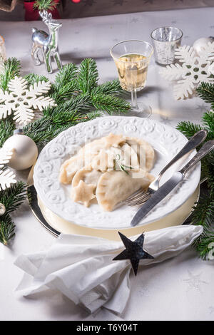 Polish style dumplings filled with sauerkraut and mushrooms Stock Photo