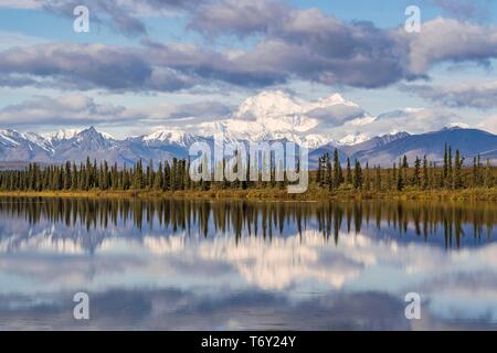 Snowy mountain Denali reflected in the lake with cloudy sky, Alaska Range, Central Alaska, Alaska, USA Stock Photo