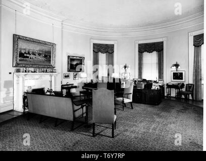 Seating, a Steinway grand piano, and several paintings in President Harry S Truman's second-floor Oval Room study, the White House, Washington, District of Columbia, July, 1948. Image courtesy National Archives. () Stock Photo