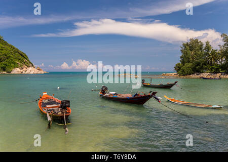 Traditional thai long boats in the sea Stock Photo