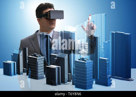 Man with virtual reality goggles doing urban planning Stock Photo