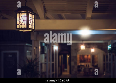 Small restaurant lit in the evening Stock Photo