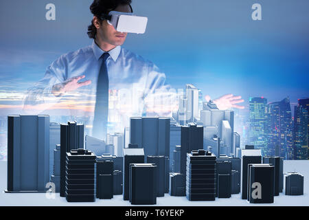 Man with virtual reality goggles doing urban planning Stock Photo