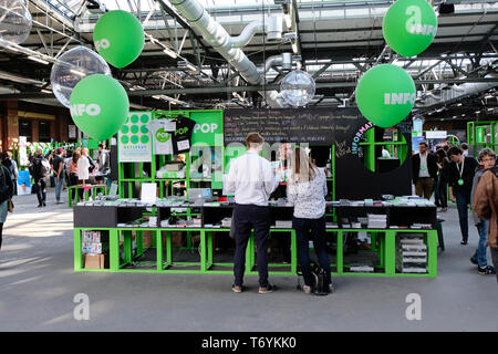 Berlin, Germany - May 3, 2018: A re:publica employee advises visitors at the info counter of the conference. re:publica is a conference about Web 2.0, Stock Photo