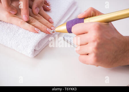 Hands during manicure care session Stock Photo