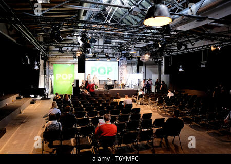 Berlin, Germany - May 3, 2018: View on a lightly frequented conference hall of the of re:publica 2018 with visitors. re:publica is a conference about  Stock Photo