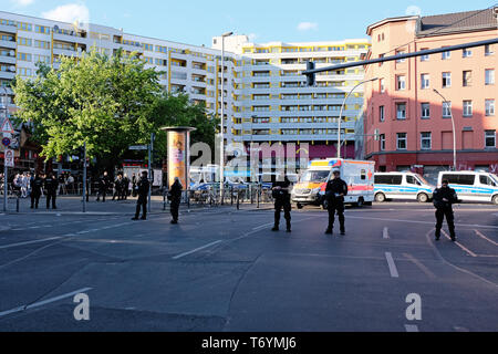 Berlin, Germany - May 01, 2018: Some policemen and police vehicles block the Kottbusser Tor square in Kreuzberg. May Day in Berlin Kreuzberg refers to Stock Photo