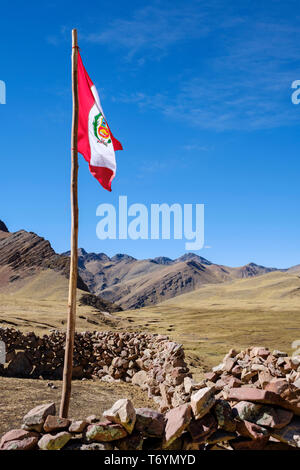 Peruvian flag on the way to the Rainbow Mountain in Los Andes, Peru Stock Photo