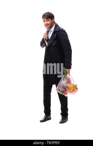 Young handsome man with vegatables in shopping concept Stock Photo