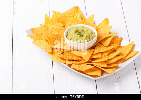 Guacamole with corn chips Stock Photo