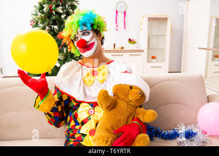 The funny clown in christmas celebration concept Stock Photo