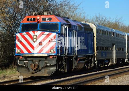 Bartlett, Illinois, USA. A Metra locomotive leading a commuter train from Chicago through Bartlett, Illinois. Stock Photo