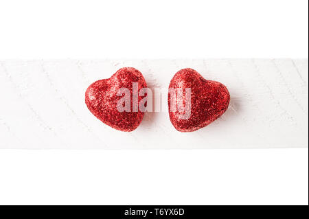 Two red glitter hearts valentines day background Stock Photo
