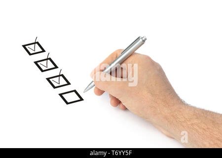 Hand with pen and check boxes Stock Photo