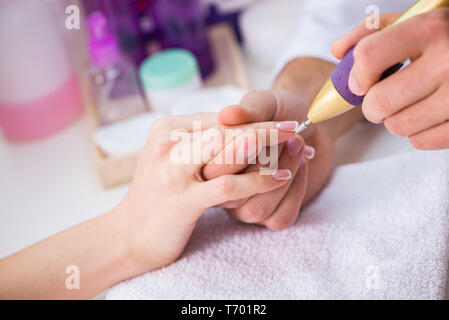 Hands during manicure care session Stock Photo