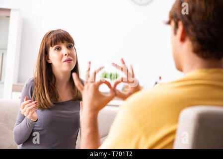 Woman and man learning sign language Stock Photo