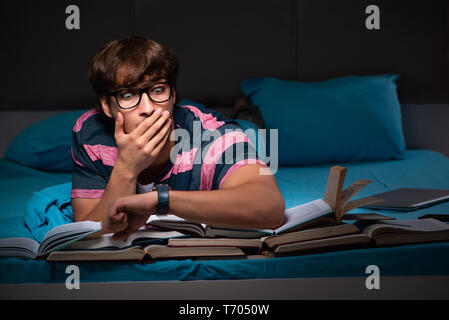 Young student preparing for exams at night at home Stock Photo