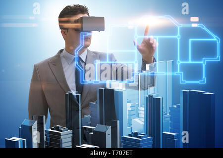 The man with virtual reality goggles doing urban planning Stock Photo