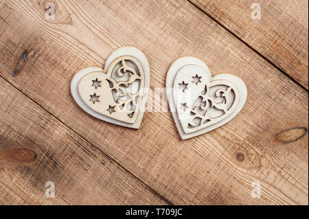 Two Wooden Hearts Placed On A Brown Wood Board. Stock Photo