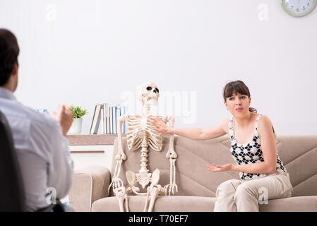 Young patient visiting psychologist for therapy Stock Photo