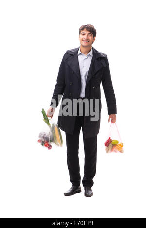 Young handsome man with vegatables in shopping concept Stock Photo