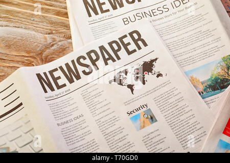 Newspapers on table Stock Photo