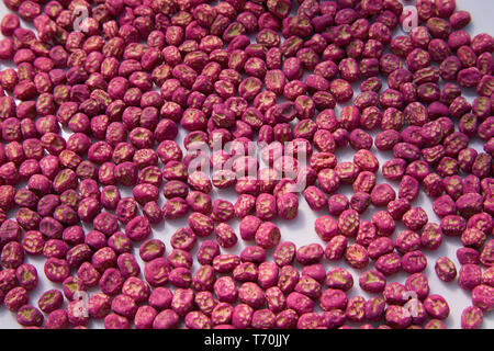 Special processing seeds on a white background. Dry pea seeds Stock Photo