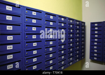 Mailboxes on wall in residential building Stock Photo