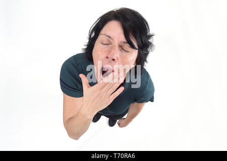 woman yawning on white background
