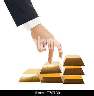 Hand and stairs made of gold bars Stock Photo