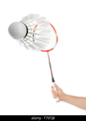 Hand with badminton racket and feather shuttlecock Stock Photo